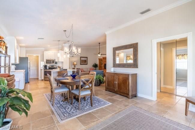 Chandelier, Dining room, Interior, Kitchen, Living room, Pendant Lights, Recessed Lighting, Stainless Steel Appliances