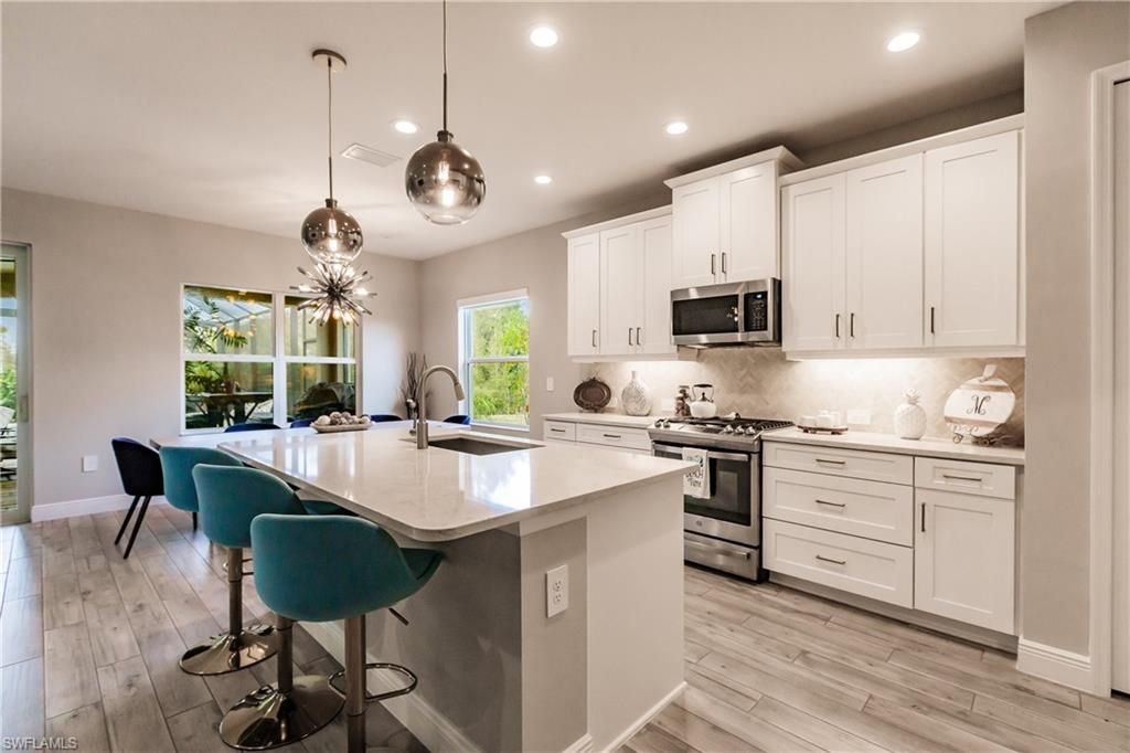 Interior, Kitchen, Pendant Lights, Recessed Lighting, Stainless Steel Appliances, Wood Texture Flooring