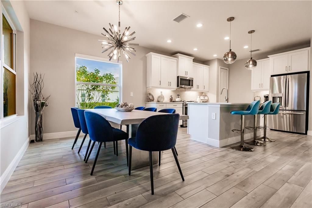 Dining room, Interior, Kitchen, Pendant Lights, Recessed Lighting, Stainless Steel Appliances, Wood Texture Flooring