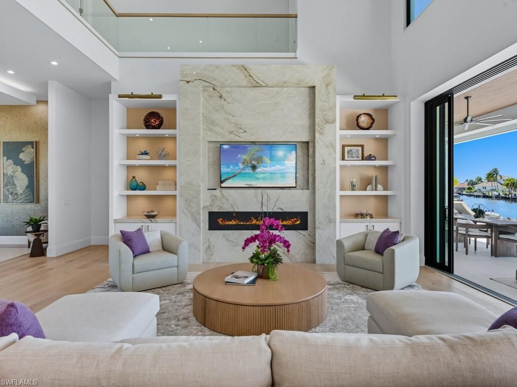 Fireplace, Interior, Living room, Marble Walls, Recessed Lighting, Water, Wood Texture Flooring