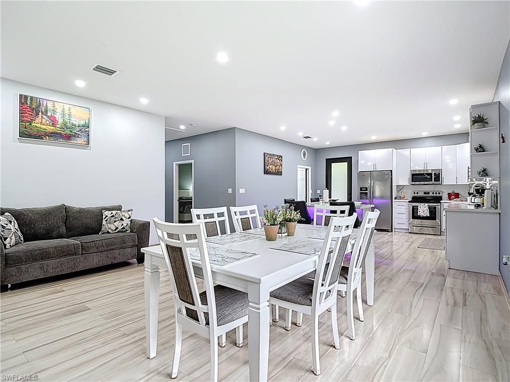 Dining room, Interior, Kitchen, Recessed Lighting, Stainless Steel Appliances, Wood Texture Flooring