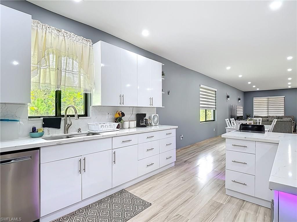 Dining room, Interior, Kitchen, Recessed Lighting, Stainless Steel Appliances, Wood Texture Flooring