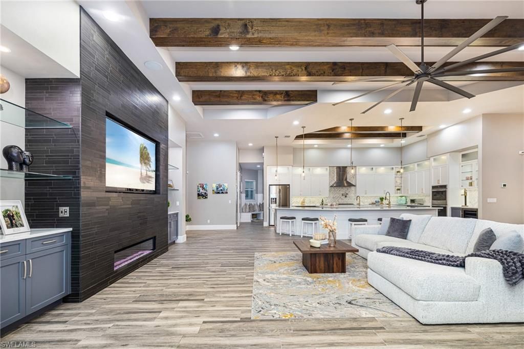 Fireplace, Interior, Kitchen, Living room, Pendant Lights, Recessed Lighting, Stainless Steel Appliances, Wooden Beams, Wood Texture Flooring