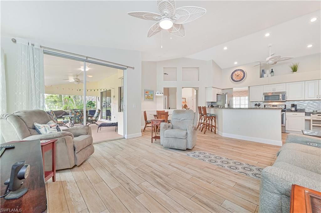 Dining room, Interior, Kitchen, Living room, Recessed Lighting, Stainless Steel Appliances, Wood Texture Flooring