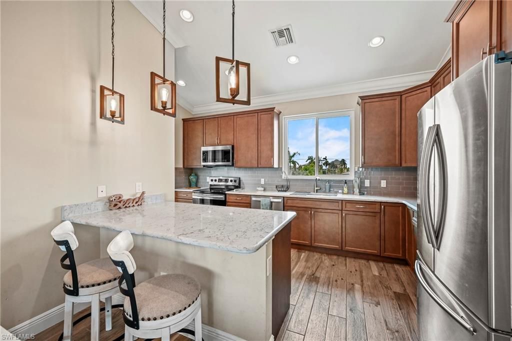 Interior, Kitchen, Pendant Lights, Recessed Lighting, Stainless Steel Appliances, Wood Texture Flooring