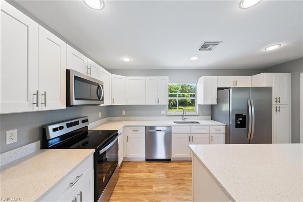 Interior, Kitchen, Recessed Lighting, Stainless Steel Appliances, Wood Texture Flooring