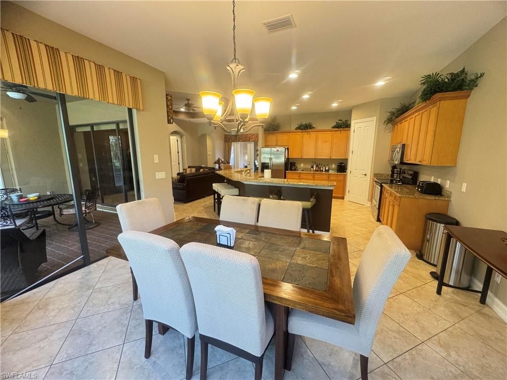 Chandelier, Dining room, Interior, Kitchen, Living room, Pendant Lights, Recessed Lighting, Stainless Steel Appliances