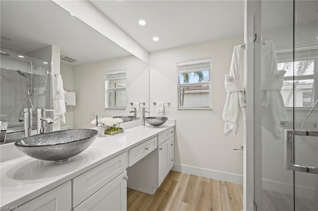 Bathroom, Dual Sink Vanities, Glass Shower, Interior, Recessed Lighting, Wood Texture Flooring