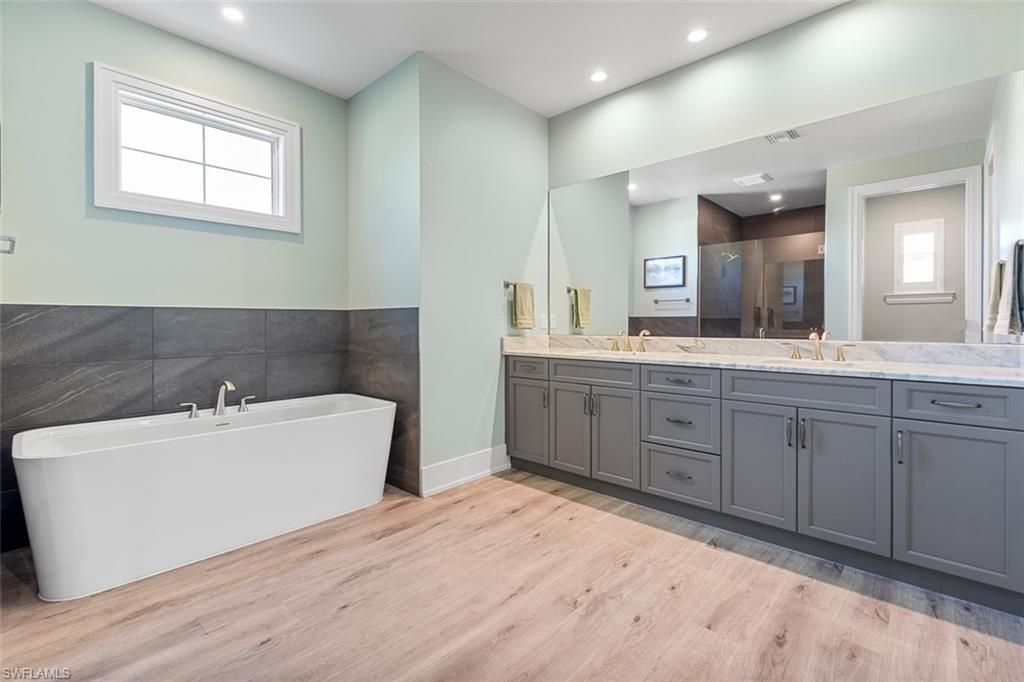 Bathroom, Dual Sink Vanities, Free Standing Baths, Interior, Recessed Lighting, Wood Texture Flooring