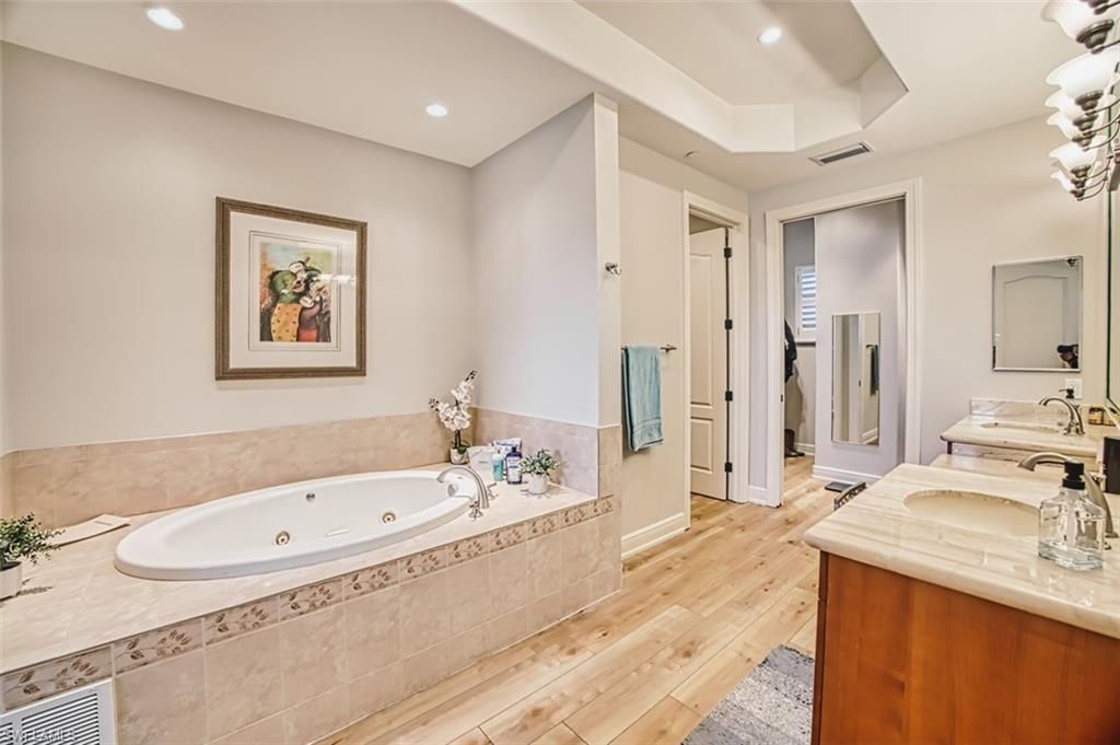 Bathroom, Dual Sink Vanities, Interior, Recessed Lighting, Wood Texture Flooring