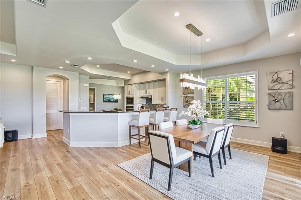Chandelier, Dining room, Interior, Kitchen, Pendant Lights, Recessed Lighting, Stainless Steel Appliances, Wood Texture Flooring