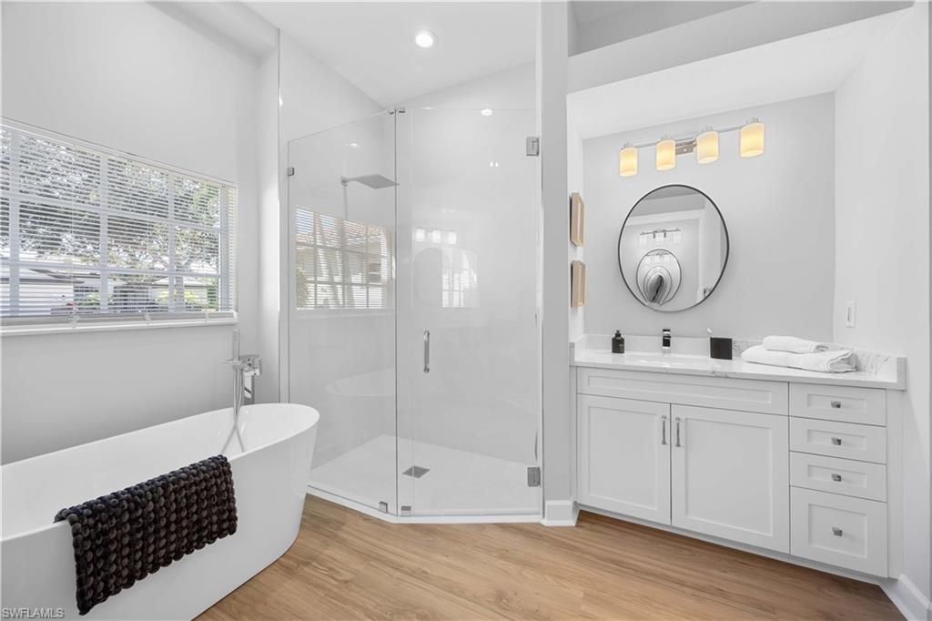 Bathroom, Free Standing Baths, Glass Shower, Interior, Recessed Lighting, Wood Texture Flooring