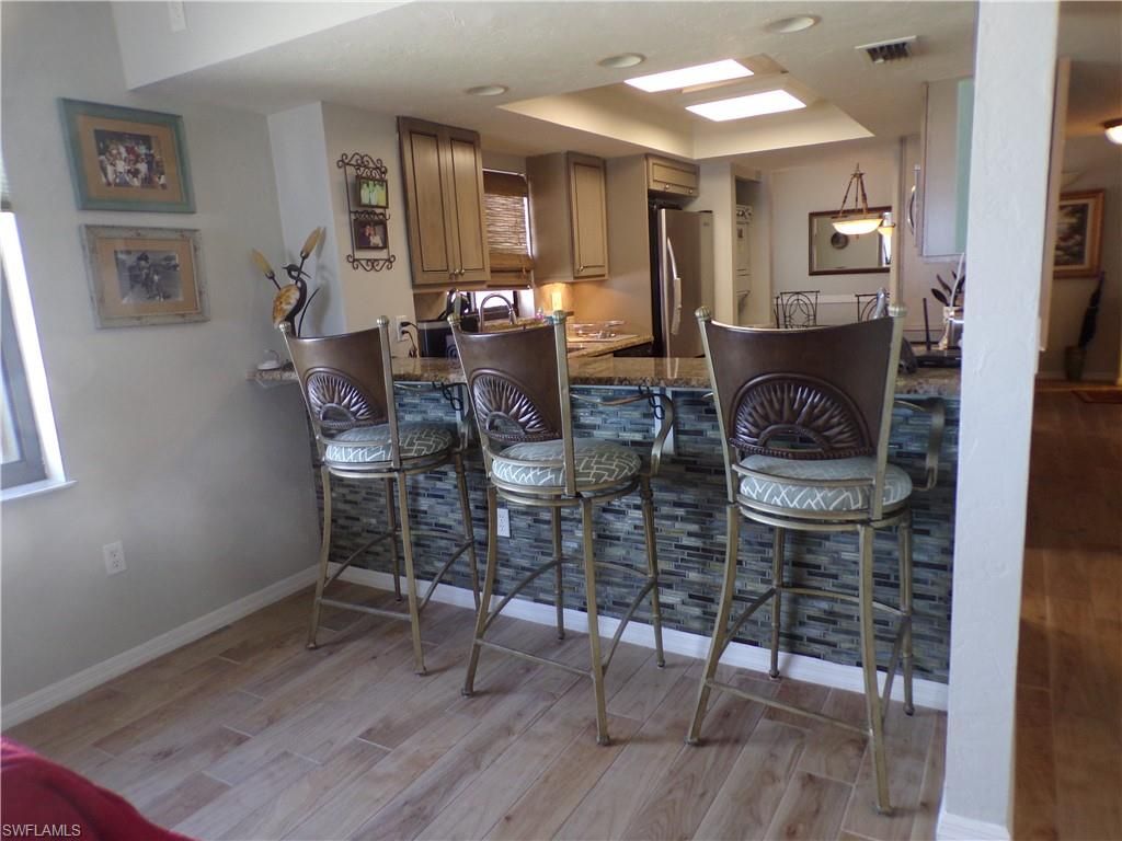 Dining room, Interior, Kitchen, Recessed Lighting, Stainless Steel Appliances, Wood Texture Flooring