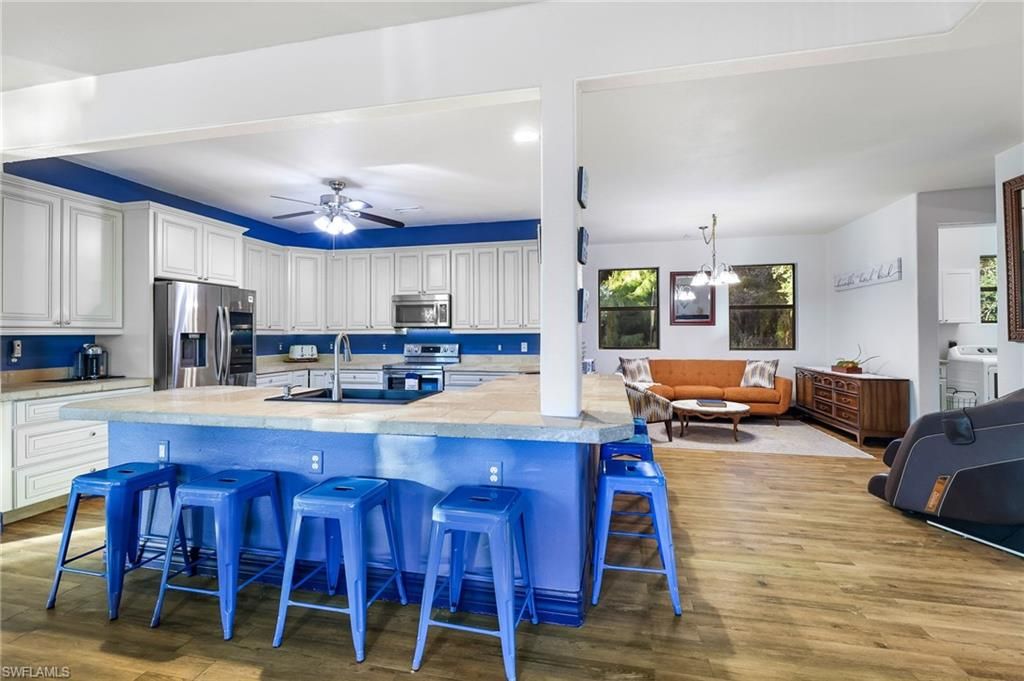 Dining room, Interior, Kitchen, Pendant Lights, Recessed Lighting, Stainless Steel Appliances, Wood Texture Flooring