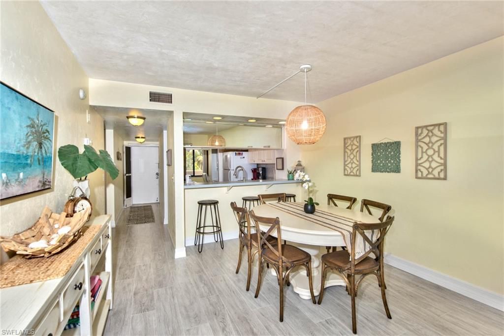 Dining room, Interior, Kitchen, Pendant Lights, Recessed Lighting, Stainless Steel Appliances, Wood Texture Flooring