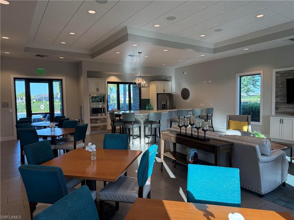 Chandelier, Dining room, Interior, Kitchen, Living room, Pendant Lights, Recessed Lighting, Stainless Steel Appliances