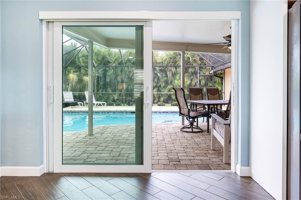 Dining room, Interior, Pool, Sun Room, Wood Texture Flooring