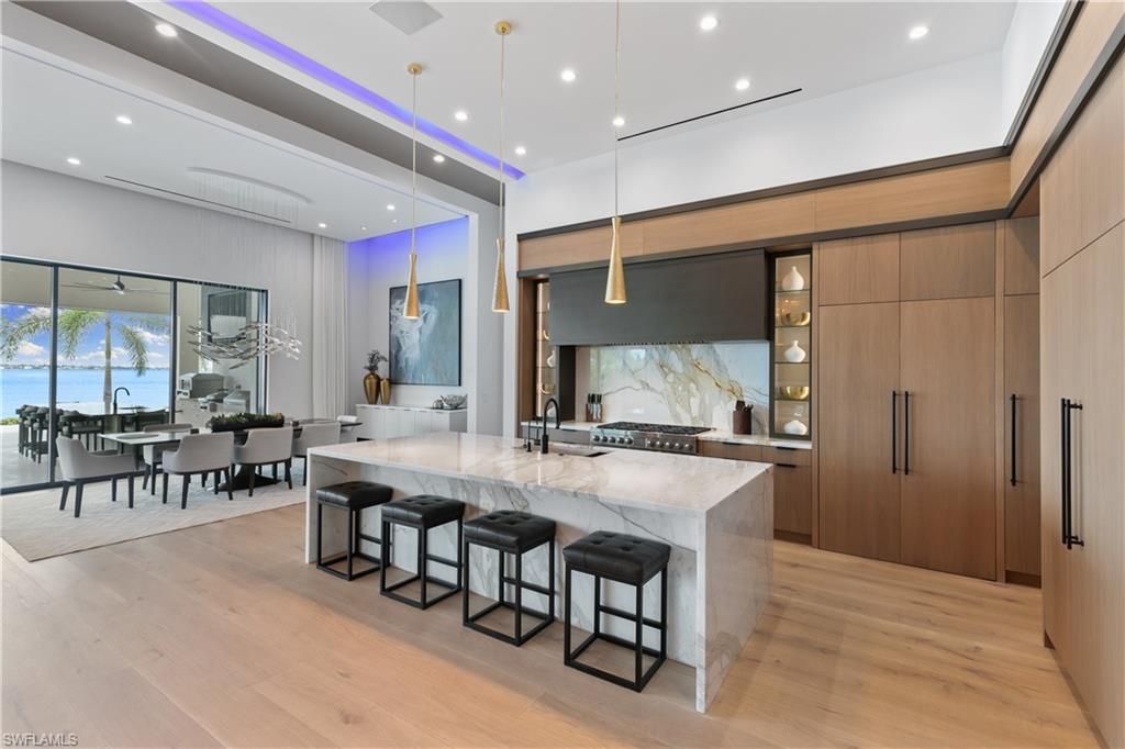 Dining room, Interior, Kitchen, Pendant Lights, Recessed Lighting, Stainless Steel Appliances, Water, Wood Texture Flooring