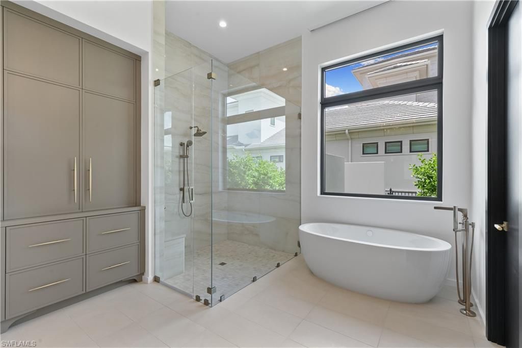 Bathroom, Free Standing Baths, Glass Shower, Interior, Marble Walls, Recessed Lighting