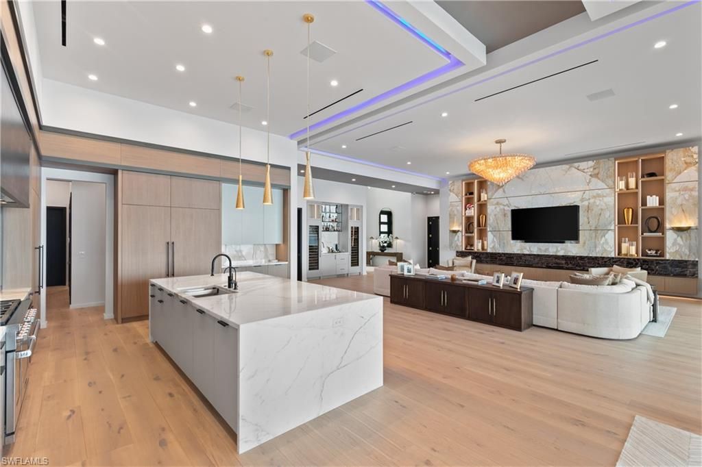 Chandelier, Fireplace, Interior, Kitchen, Living room, Pendant Lights, Recessed Lighting, Wood Texture Flooring