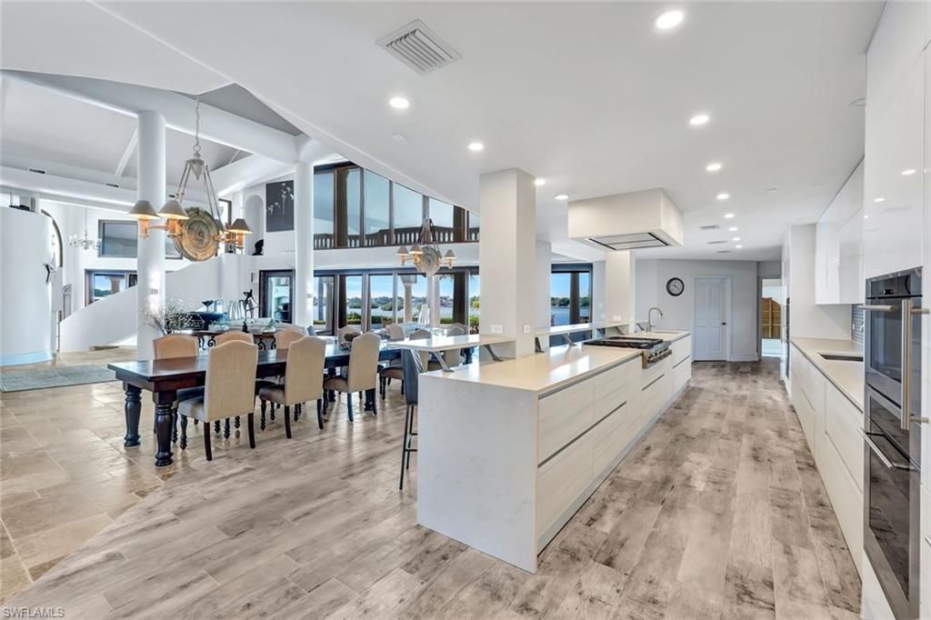 Dining room, Interior, Kitchen, Pendant Lights, Recessed Lighting, Stainless Steel Appliances, Wood Texture Flooring