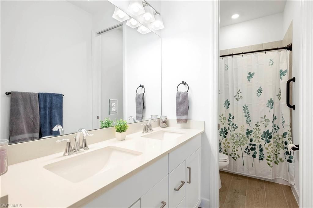 Bathroom, Dual Sink Vanities, Interior, Recessed Lighting, Wood Texture Flooring
