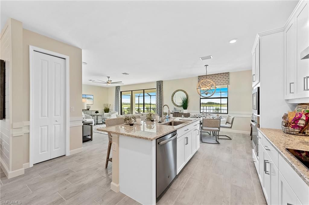 Dining room, Interior, Kitchen, Living room, Pendant Lights, Recessed Lighting, Stainless Steel Appliances, Wood Texture Flooring