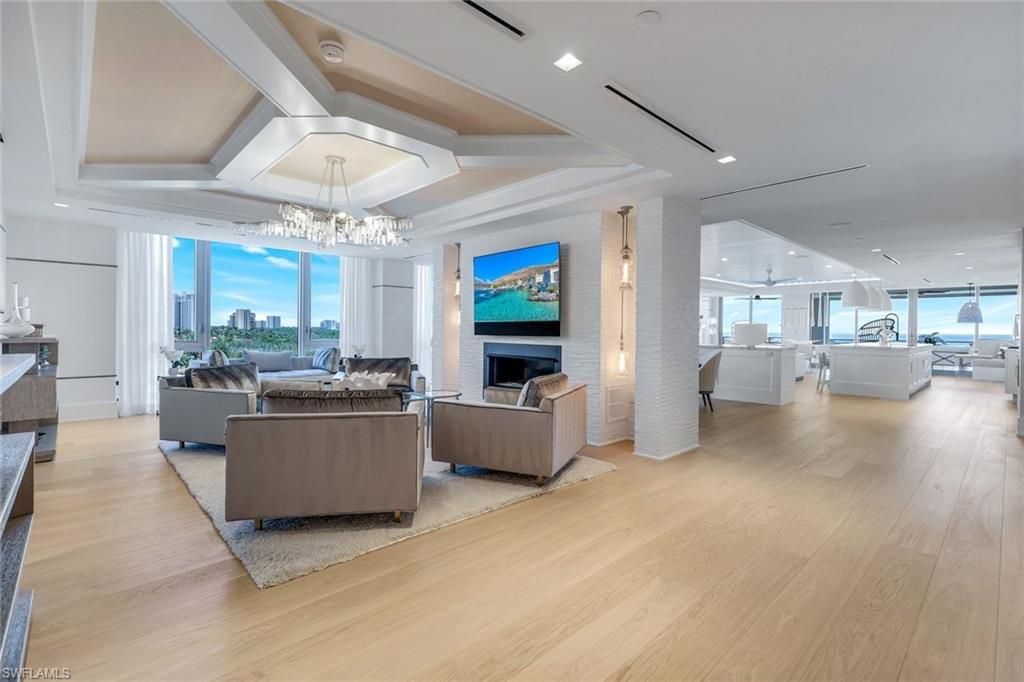 Chandelier, Fireplace, Interior, Living room, Pendant Lights, Recessed Lighting, Water, Wood Texture Flooring