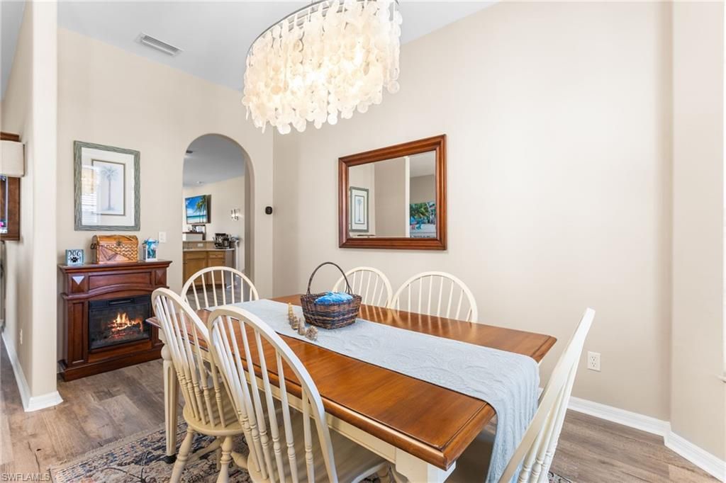 Chandelier, Dining room, Fireplace, Interior, Wood Texture Flooring