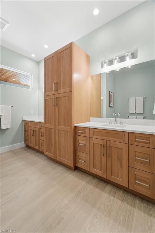 Bathroom, Dual Sink Vanities, Interior, Recessed Lighting, Wood Texture Flooring