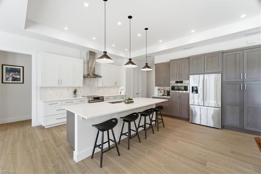Interior, Kitchen, Pendant Lights, Recessed Lighting, Stainless Steel Appliances, Wood Texture Flooring