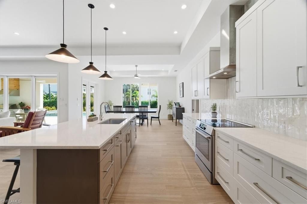 Dining room, Interior, Kitchen, Pendant Lights, Recessed Lighting, Stainless Steel Appliances, Wood Texture Flooring
