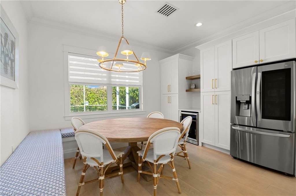 Chandelier, Dining room, Interior, Kitchen, Pendant Lights, Recessed Lighting, Stainless Steel Appliances, Wood Texture Flooring