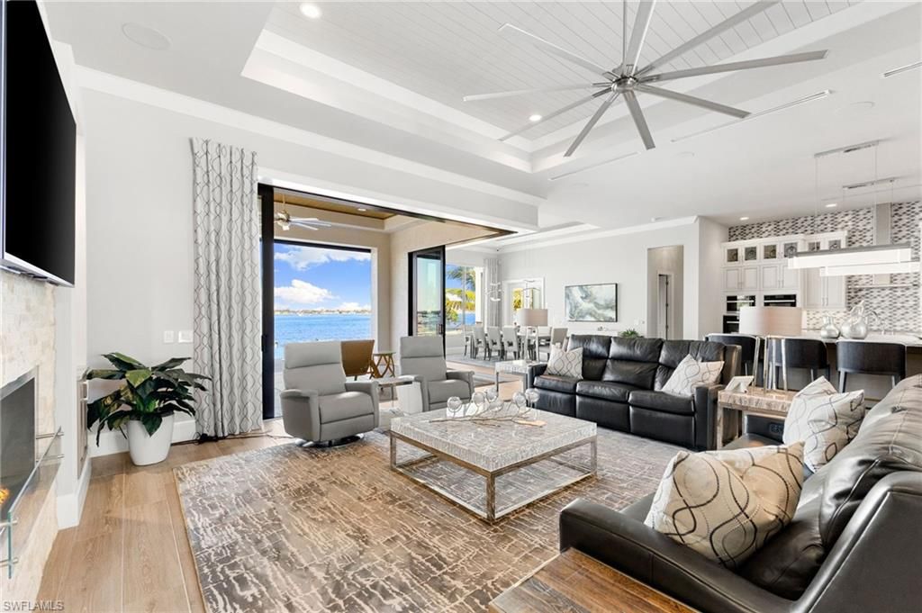 Fireplace, Interior, Kitchen, Living room, Pendant Lights, Recessed Lighting, Water, Wood Texture Flooring