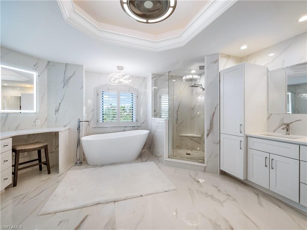 Bathroom, Dual Sink Vanities, Free Standing Baths, Glass Shower, Interior, Marble, Marble Walls, Recessed Lighting