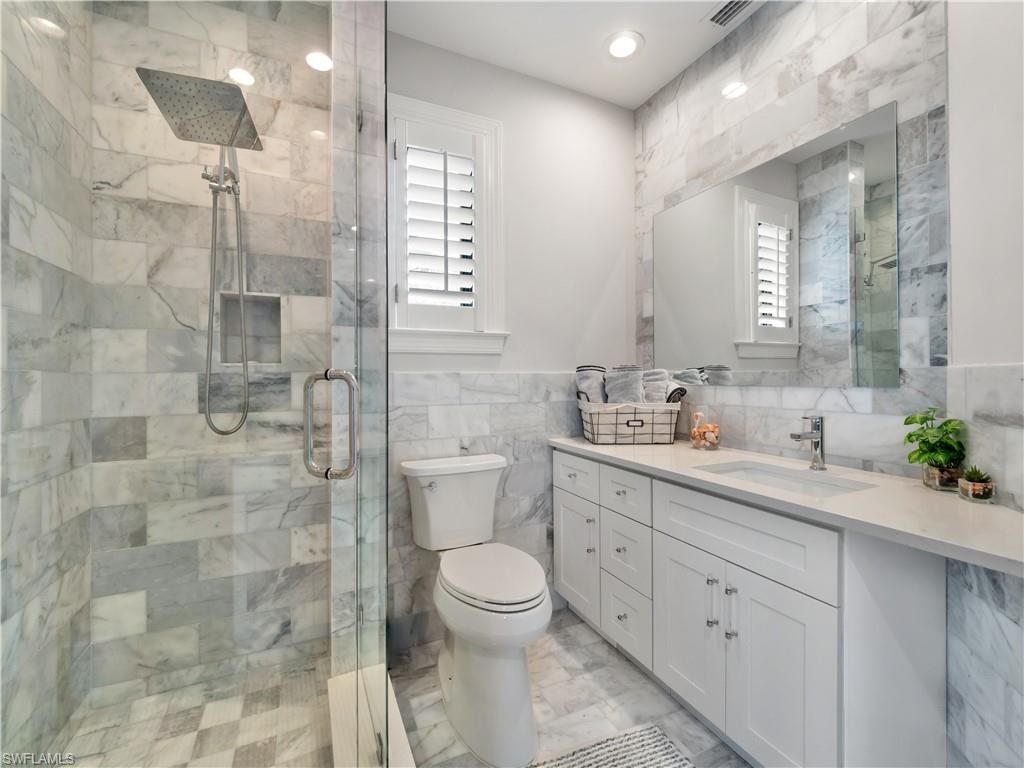 Bathroom, Dual Sink Vanities, Glass Shower, Interior, Marble, Marble Walls, Recessed Lighting