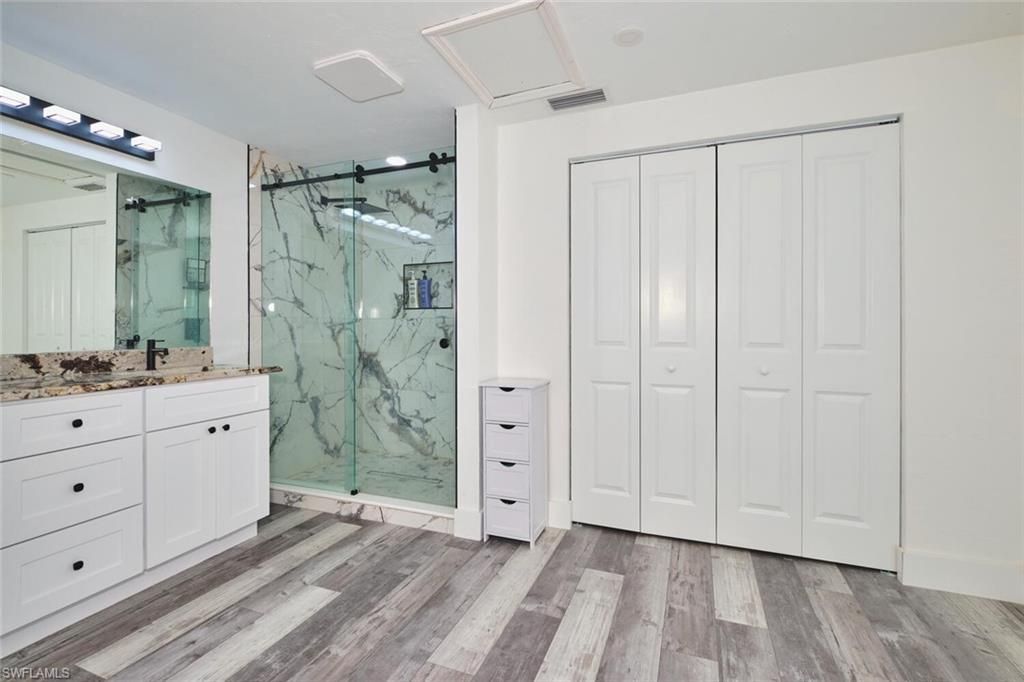 Bathroom, Glass Shower, Interior, Marble Walls, Wood Texture Flooring