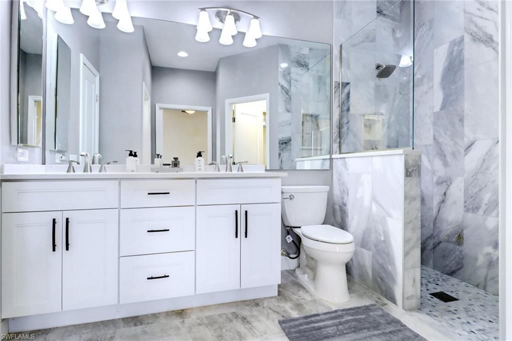 Bathroom, Dual Sink Vanities, Glass Shower, Interior, Marble Walls, Recessed Lighting
