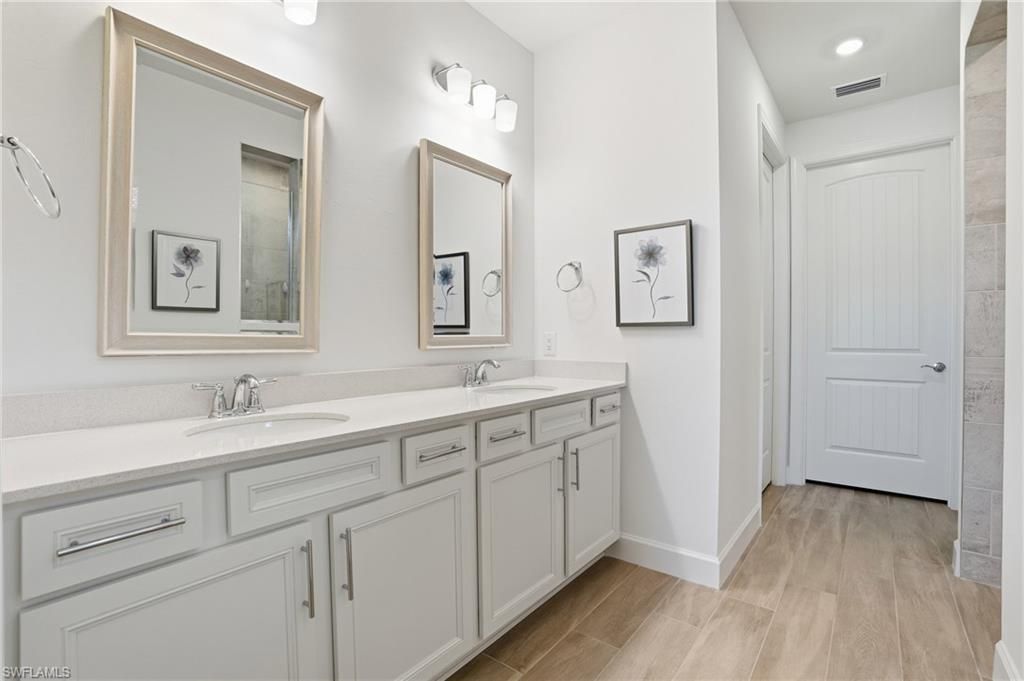 Bathroom, Dual Sink Vanities, Interior, Recessed Lighting, Wood Texture Flooring