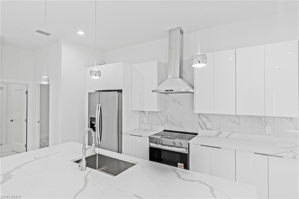 Interior, Kitchen, Marble Walls, Pendant Lights, Recessed Lighting, Stainless Steel Appliances