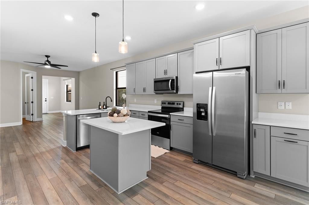 Interior, Kitchen, Pendant Lights, Recessed Lighting, Stainless Steel Appliances, Wood Texture Flooring