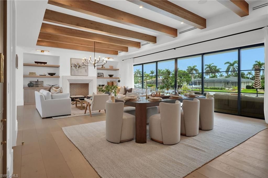 Chandelier, Dining room, Fireplace, Interior, Living room, Pendant Lights, Recessed Lighting, Wooden Beams, Wood Texture Flooring