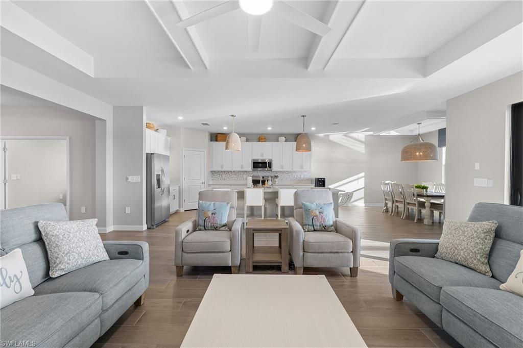 Dining room, Interior, Kitchen, Living room, Pendant Lights, Recessed Lighting, Stainless Steel Appliances, Wood Texture Flooring