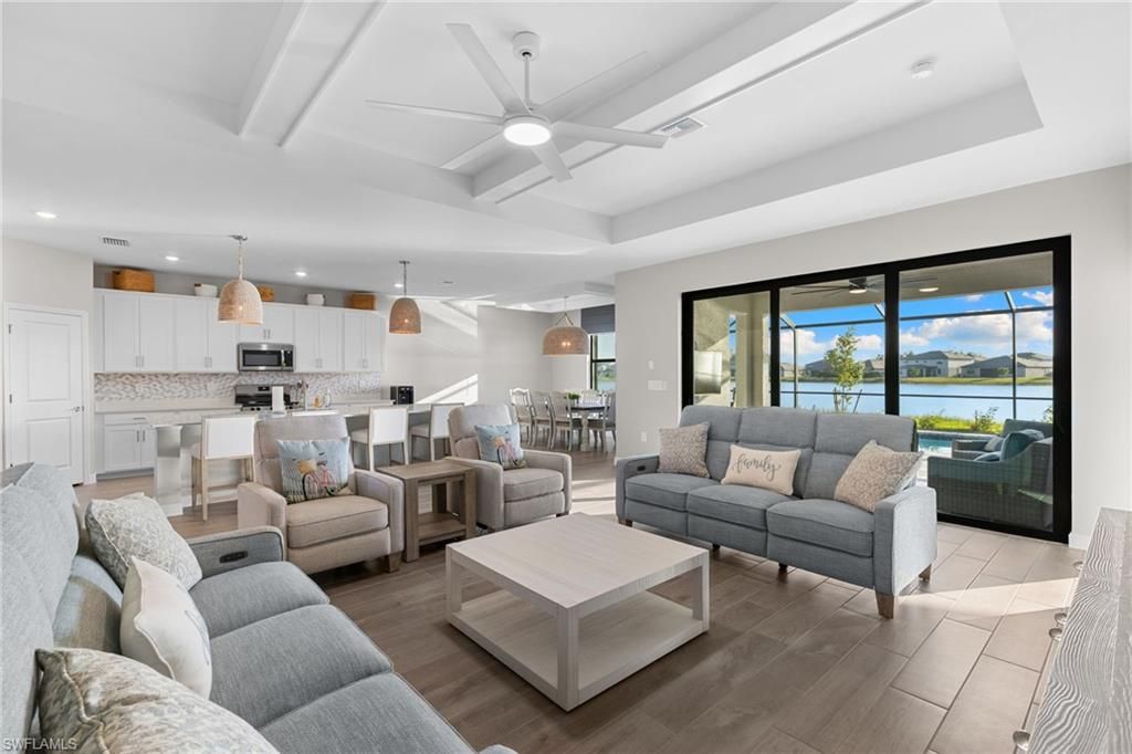 Dining room, Interior, Kitchen, Living room, Pendant Lights, Recessed Lighting, Stainless Steel Appliances, Water, Wood Texture Flooring