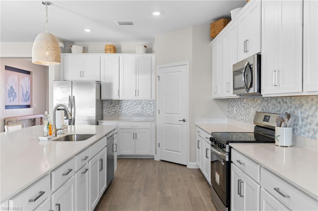 Interior, Kitchen, Pendant Lights, Recessed Lighting, Stainless Steel Appliances, Wood Texture Flooring