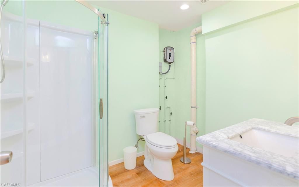 Bathroom, Glass Shower, Interior, Recessed Lighting, Wood Texture Flooring