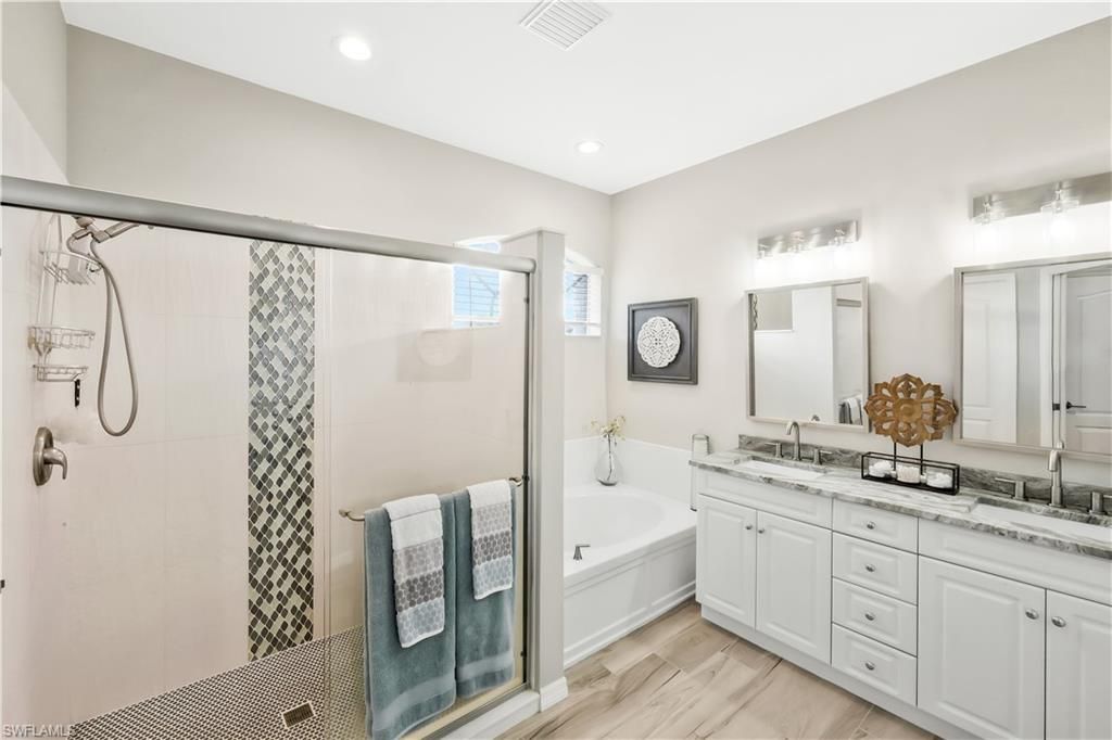 Bathroom, Dual Sink Vanities, Glass Shower, Interior, Recessed Lighting, Wood Texture Flooring