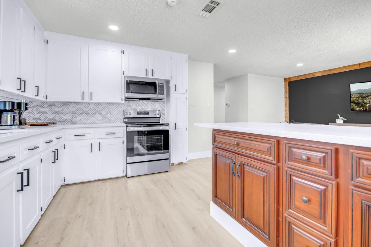 Interior, Kitchen, Recessed Lighting, Stainless Steel Appliances, Wood Texture Flooring