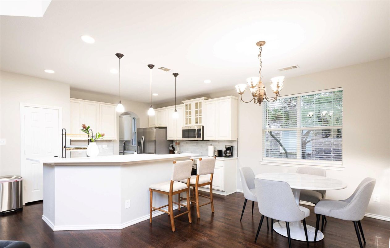 Chandelier, Dining room, Interior, Kitchen, Pendant Lights, Recessed Lighting, Stainless Steel Appliances, Wood Texture Flooring