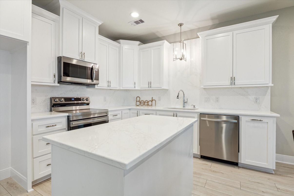 Interior, Kitchen, Marble Walls, Pendant Lights, Recessed Lighting, Stainless Steel Appliances, Wood Texture Flooring